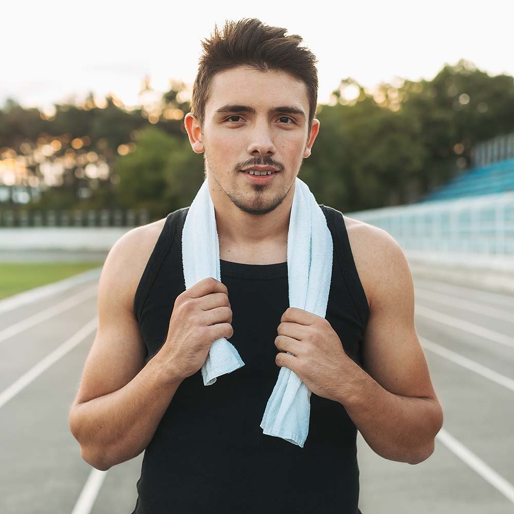 portrait-of-a-relaxing-fitness-man-with-towel-on-s-PE3GPU7.jpg